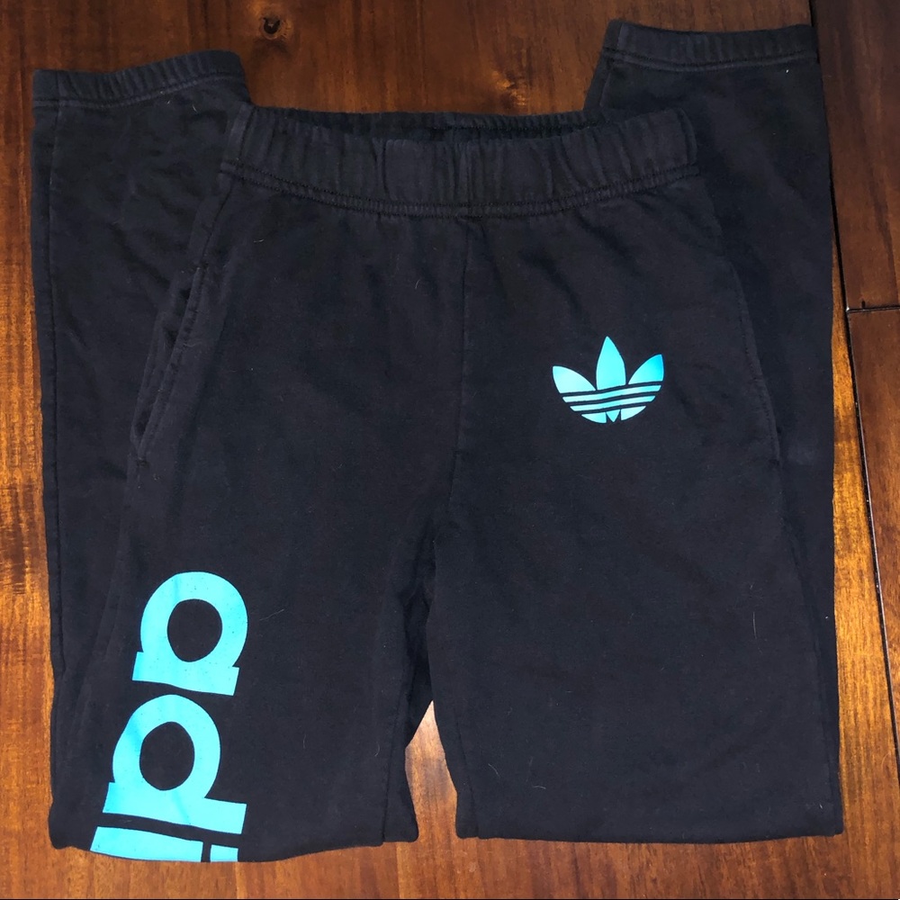 Adidas sweatpants with blue adidas fade writing